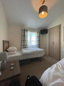 a bedroom with a large bed and a window at LA07 Oceanview in Morecambe