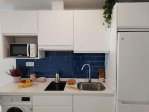 Kuchyňa alebo kuchynka v ubytovaní Bnbook Medea Apartments 2