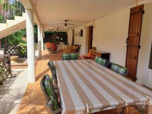 a bed sitting on a porch with a patio at La Batisse in Saint-Laurent