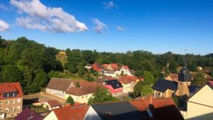 an aerial view of a town with houses and trees at 2 Zimmer mit Netflix, Prime, Küche, Bad in Seenähe in Unterwellenborn
