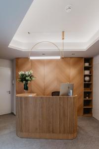 an office with a desk with a laptop on it at Hotel Petit Luxe in Terrassa