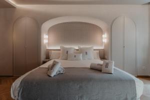 Posteľ alebo postele v izbe v ubytovaní Hotel Petit Luxe
