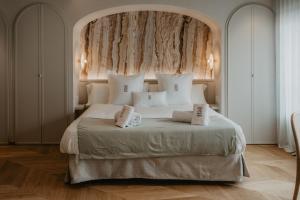 Posteľ alebo postele v izbe v ubytovaní Hotel Petit Luxe