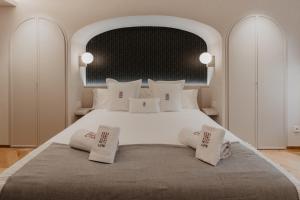 Posteľ alebo postele v izbe v ubytovaní Hotel Petit Luxe