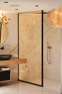 a bathroom with a shower with a glass door at Domaine Des Hautes Fagnes in Ovifat