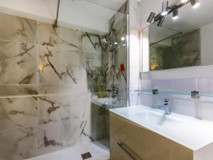 a bathroom with a sink and a shower at Apartment Les Goélands-1 by Interhome in Cap d'Agde