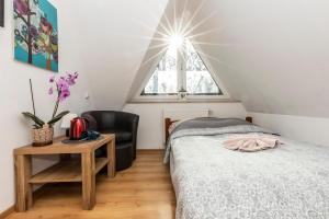 Postel nebo postele na pokoji v ubytování Brzoza w centrum Zakopanego