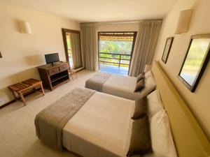 Postel nebo postele na pokoji v ubytování Santa Clara Hotel