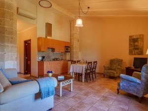 a living room with a couch and a table at Apartment Agroturismo Roqueta - MDS101 by Interhome in Maria de la Salut