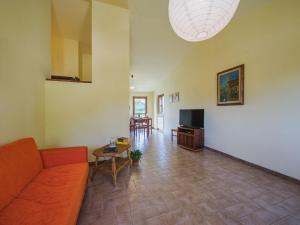 a living room with a couch and a table at Apartment Ca` del Lovi-1 by Interhome in Chiatri +20 photos