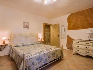 a bedroom with a bed and a dresser at Holiday Home Lisena by Interhome in Balconevisi +45 photos