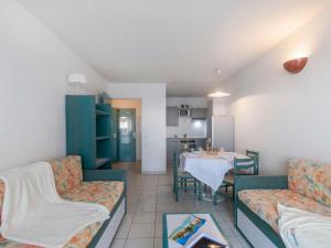 a living room with two couches and a table at Apartment L'Open-2 by Interhome in Fréjus