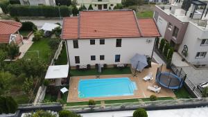 an aerial view of a house with a swimming pool at Villa Lucija in Veles