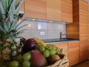 a basket of fruit sitting in a kitchen at Apartment Rosablanche E003A by Interhome in Siviez