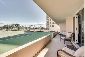 a tennis court on a balcony with a tennis court at Amazing Waterview Towers 104 Condo With Boat Slip in Destin