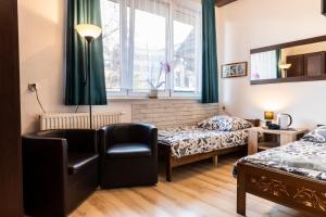 Postel nebo postele na pokoji v ubytování Brzoza w centrum Zakopanego