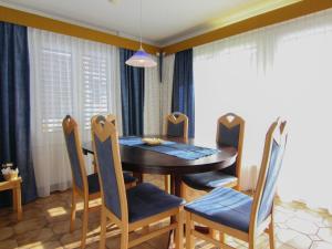 a dining room with a table and chairs at Apartment Casa Yolanda Mireille by Interhome in Fieschertal