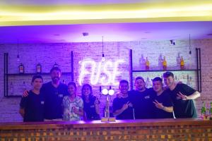 a group of people standing at a bar at Fuse Old Town Hoi An in Hoi An