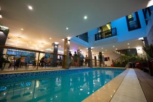 a swimming pool in the middle of a building at Fuse Old Town Hoi An in Hoi An