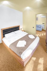 Voodi või voodid majutusasutuse LALO Hotel Abastumani toas