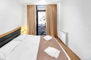 Voodi või voodid majutusasutuse LALO Hotel Abastumani toas