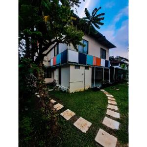 a house with colorful paint on the side of it at Nature Villa Kochi in Alwaye