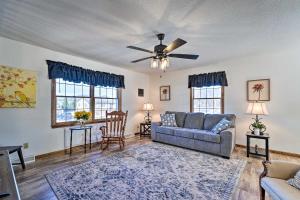 a living room with a couch and a ceiling fan at Cozy Vacation Rental Home Near Watauga Lake! in Elizabethton