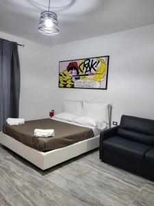 Letto o letti in una camera di Dimore Pietrapenta Apartments, Suites & Rooms - Via Lucana 223, Via Piave 23, Via Chiancalata 16