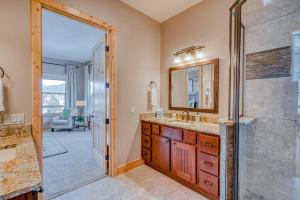 a bathroom with a shower and a sink and a mirror at Cutbow Lodge in South Fork +77 photos