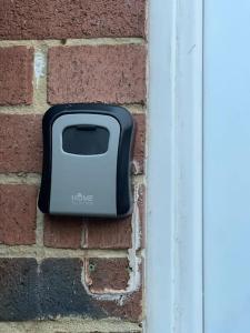 a toaster on the side of a brick wall at Stylish and Modern Apartment close to Dover Port! in Kent