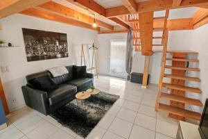Posezení v ubytování Joli duplex avec piscine