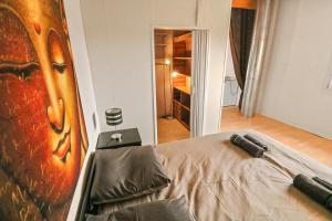 Postel nebo postele na pokoji v ubytování Joli duplex avec piscine