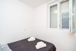 Postel nebo postele na pokoji v ubytování Apartment Joky