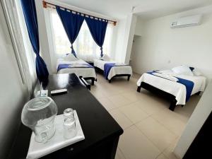 Voodi või voodid majutusasutuse Hotel Cally toas