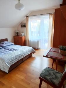 Postel nebo postele na pokoji v ubytování Szarotka Pienińska