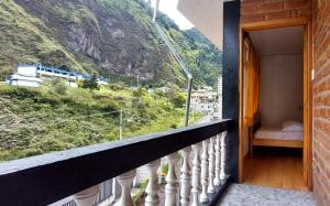 a balcony with a view of a mountain at Hostal Colibri 2 in Baños