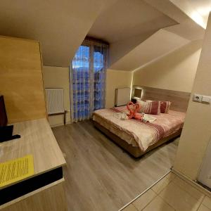 Postel nebo postele na pokoji v ubytování Guesthouse Pumpalovi