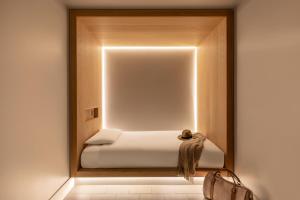 a room with a bed in a mirror at Zedwell Piccadilly Circus in London