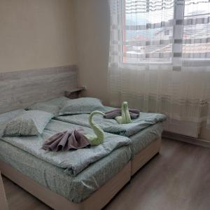 Postel nebo postele na pokoji v ubytování Guesthouse Pumpalovi