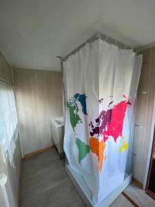 a refrigerator with a map of the world on it at Gîte pèlerin - "Les Sources" - Chambres Dortoirs in Le Vigan +24 photos