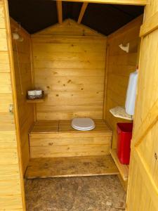 a wooden outhouse with a toilet in it at Gîte pèlerin - "Les Sources" - Chambres Dortoirs in Le Vigan