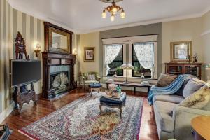 a living room with a couch and a fireplace at Historic Guard House in Tucson