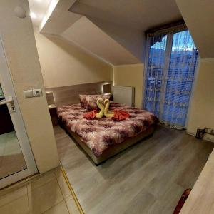 Postel nebo postele na pokoji v ubytování Guesthouse Pumpalovi
