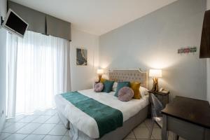 Postel nebo postele na pokoji v ubytování Hotel Continental
