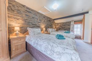 Voodi või voodid majutusasutuse Middlefield Cottage Coniston Water toas