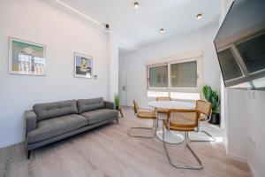 Televízia a/alebo spoločenská miestnosť v ubytovaní Exclusive Alameda - Comfort & Design
