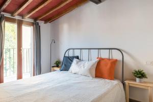 Giường trong phòng chung tại Centrale APT con terrazza a 5min dal Pitti! - HomeUnity