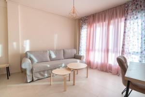 a living room with a couch and a table at Monastiraki metro station studio for 4 persons in Athens