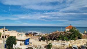 a view of the ocean from a building at Hello Piles Beach Javier in Piles