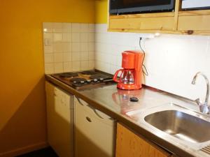a kitchen counter with a mixer and a sink at 3 pièces 60m², 8 pers, proche pistes, animaux acceptés - FR-1-636-119 in Orcières +4 photos